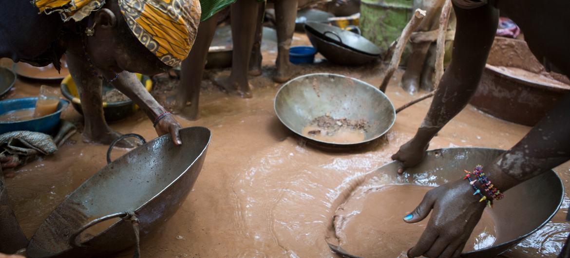Women pan for gold by using mercury at the Worognan mining site in Bougouni, Mali.